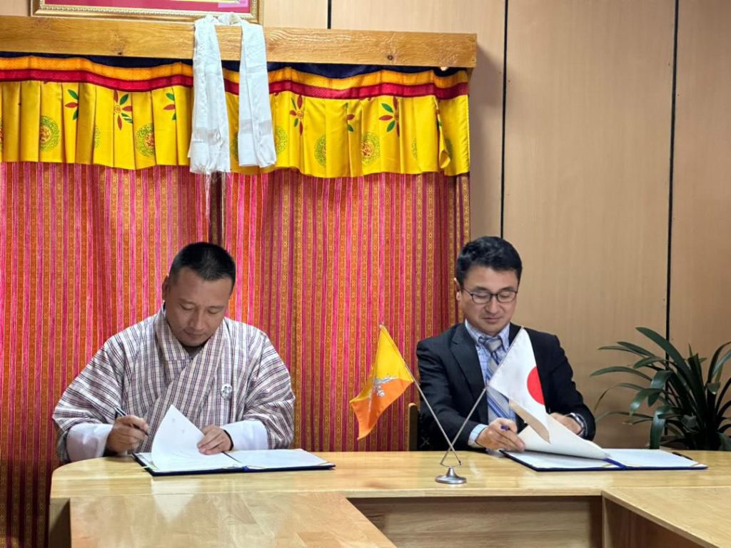 Officials signing Grant Agreements for the Reconstruction of Bridges on Primary National Highway No.1 in Mongar District and the Human Resource Development Scholarship Project